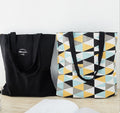 Single-shoulder bag black and yellow geometric shapes