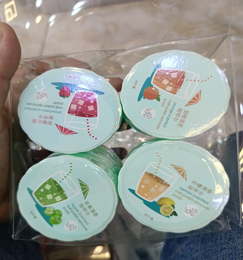 Fruit scented nail polish remover pads