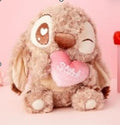wincked eye holding heart stich plush