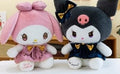 black and pink krumi plush doll