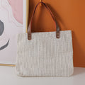 Simple geometric shopping bag with leather shoulder strap