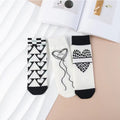 Simple black and white love women's mid-calf cotton socks (two pairs)