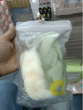 green and white bath tools